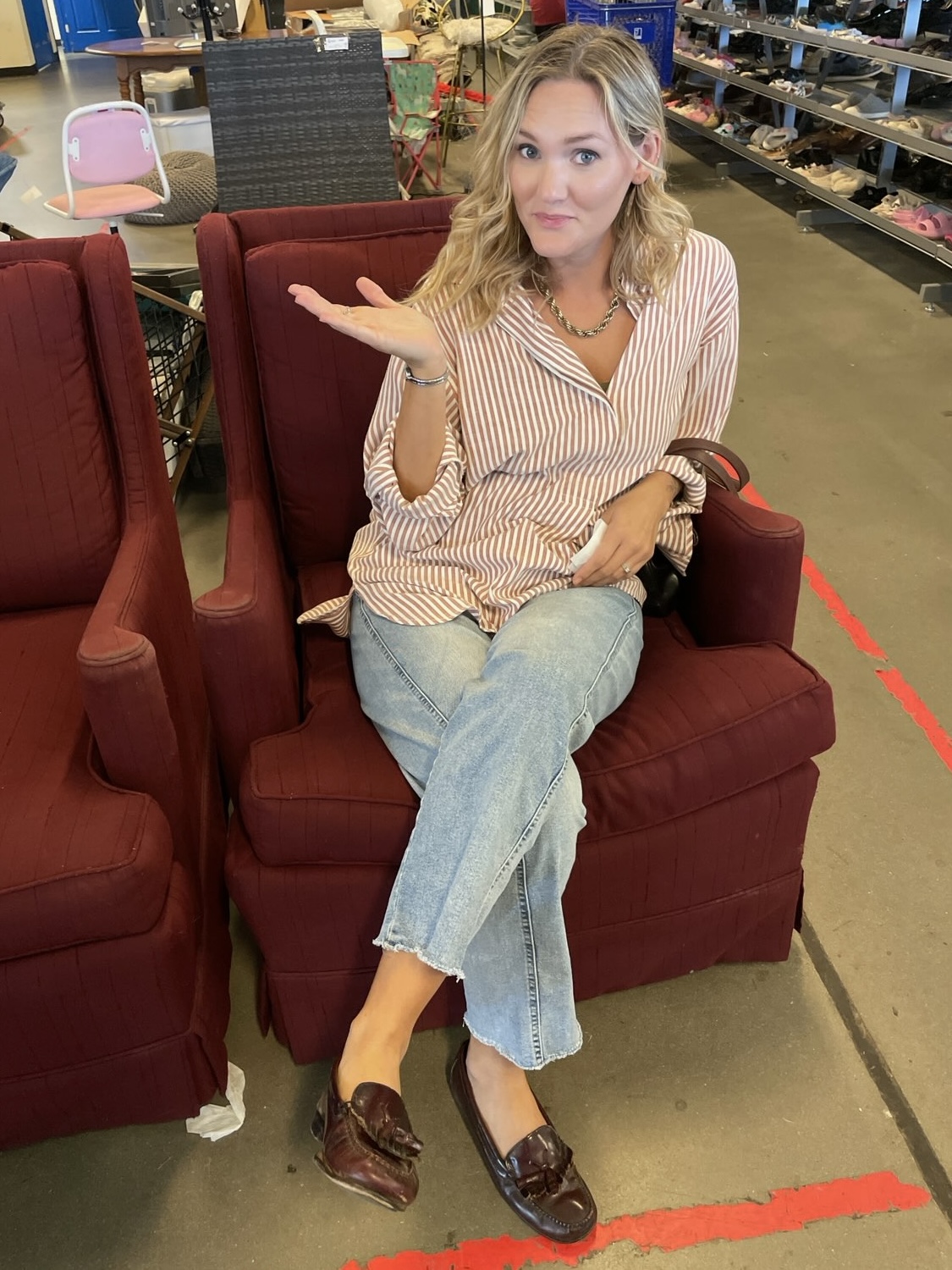 Rabekah sitting in a burgundy armchair